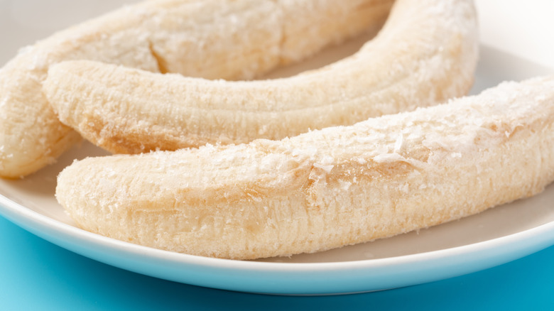 Frozen whole bananas on a plate