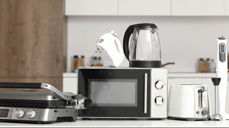 Various kitchen appliances on countertop