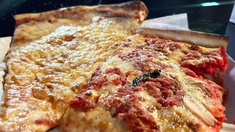 A plain and a Sicilian slice from Rosa's Pizza.