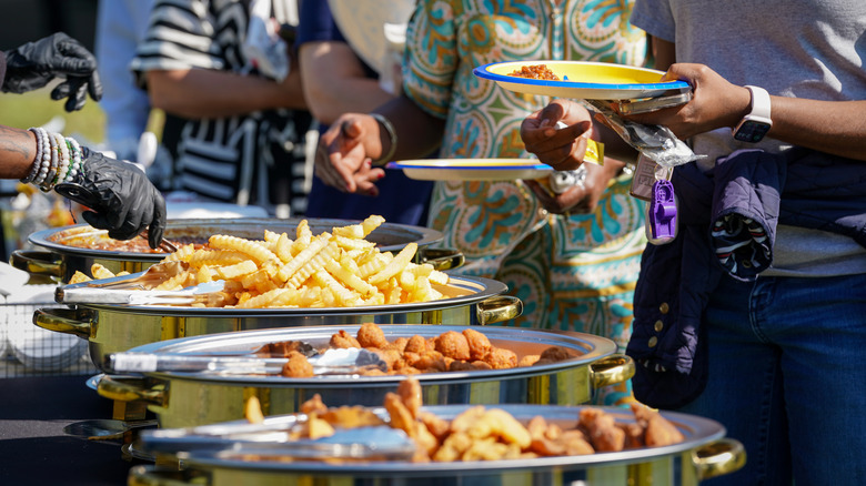 People lining up at a community fish fry