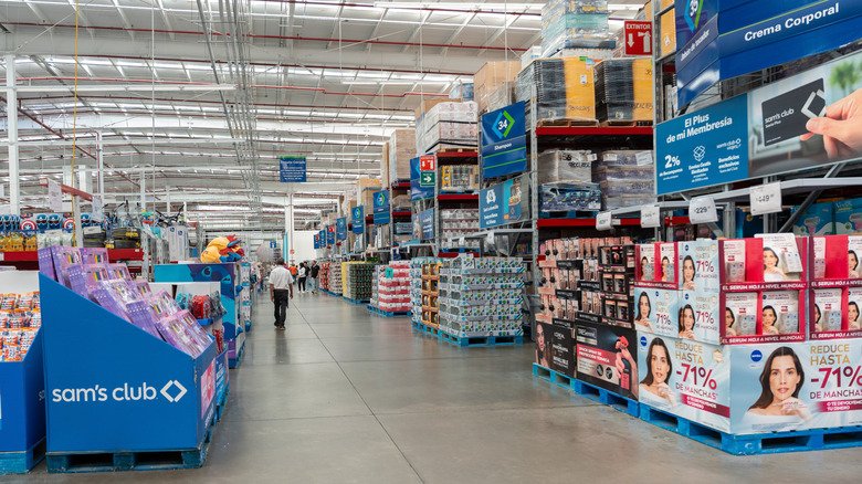 The interior of a Sam's Club store with several shoppers visible