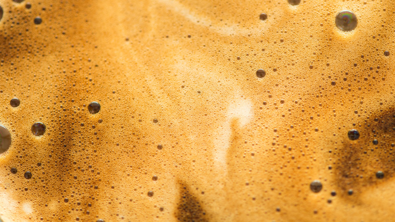 A close up of espresso foam.