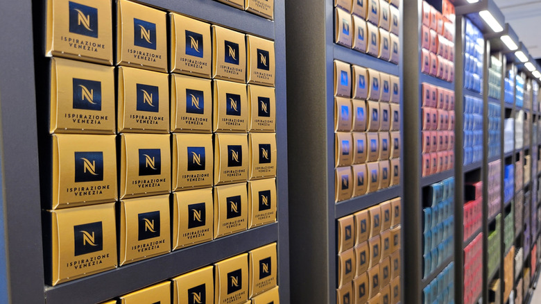 Nespresso pods on display in a store.