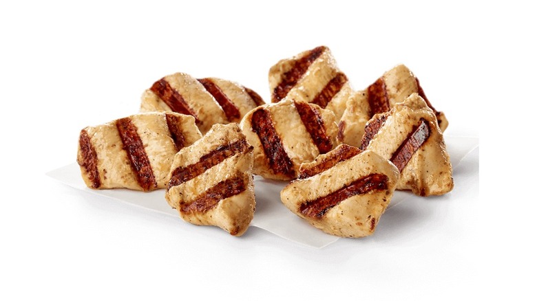 Chick-fil-A grilled chicken nuggets in front of white background