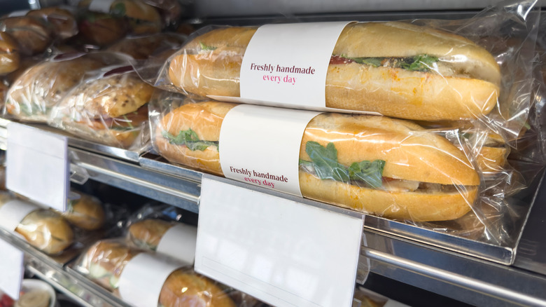 premade, plastic-wrapped subs in a grocery store