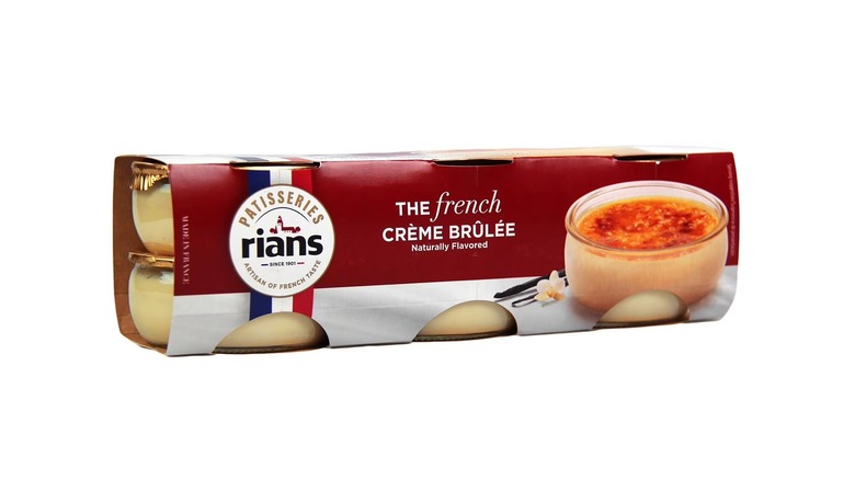 A box of individually portioned French style crème brûlées on a white background