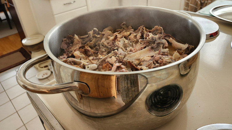 chicken bones in a stock pot
