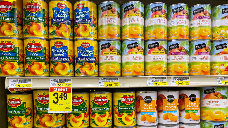 Rows of canned peaches in the supermarket