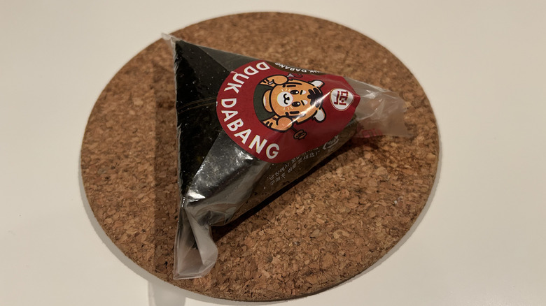 Bulgogi triangle rice, wrapped, on a table