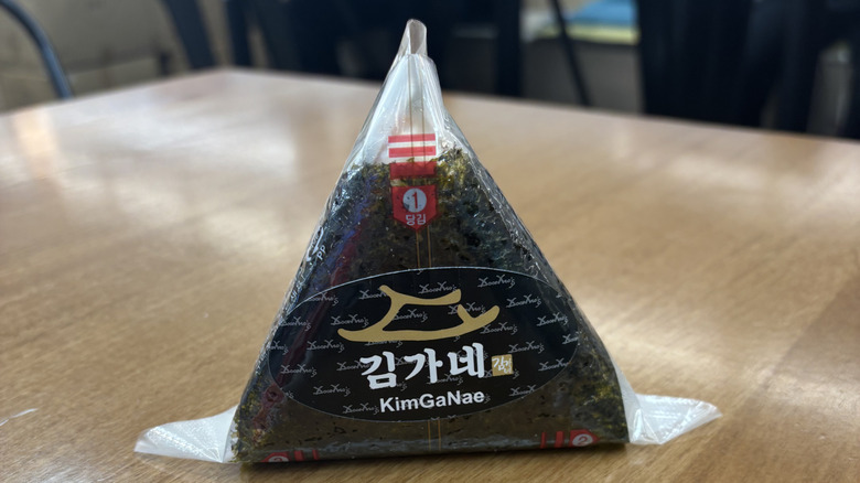 Spicy tuna triangle kimbap on a food court table