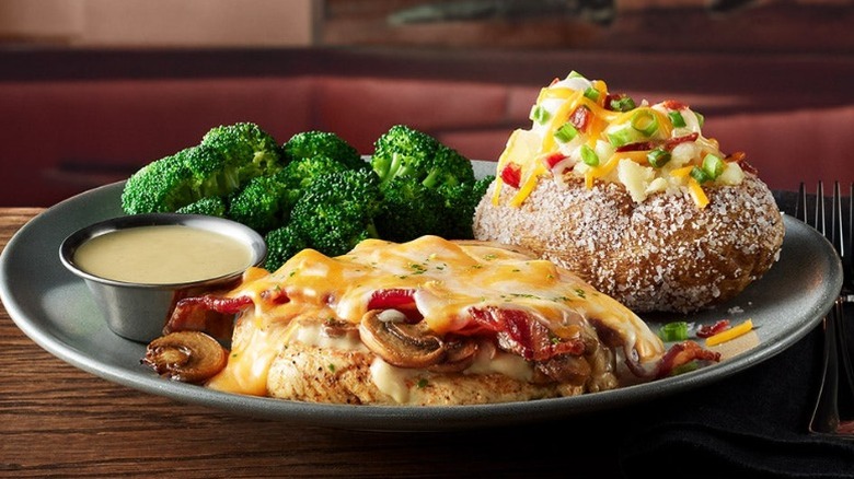 Outback Steakhouse Alice Springs Chicken with broccoli and a loaded baked potato
