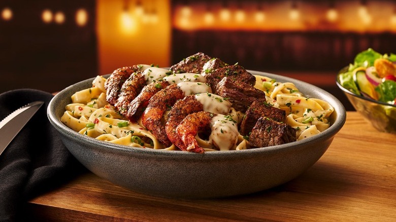Outback Kingsland Steak and Shrimp Pasta in a grey bowl