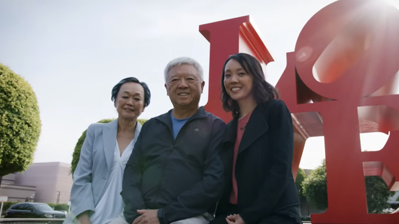 Cherng family which owns Panda Express in front of the iconic LOVE statue.