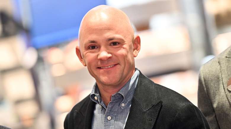 Andrew Cathy, CEO of Chick-fil-A smiles at camera.