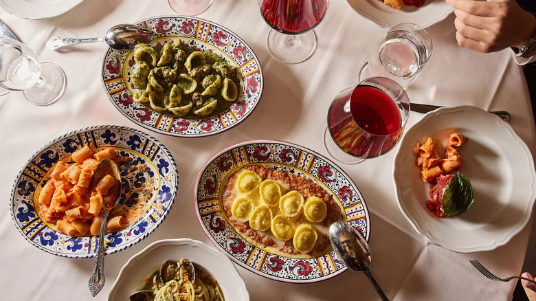 Pasta spread and red wine at Carbone Miami.