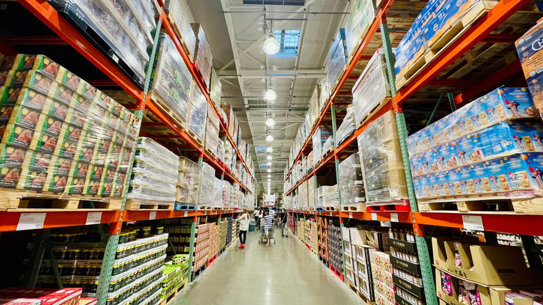 The aisles of a sparsely populated, well-stocked Costco store