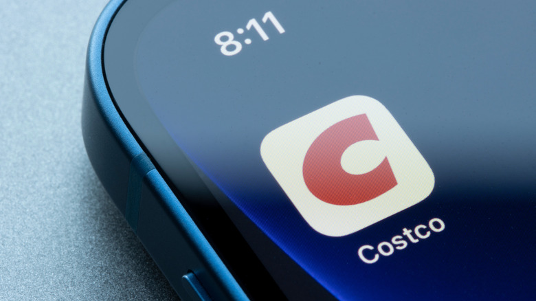 A smartphone with the Costco app's logo onscreen