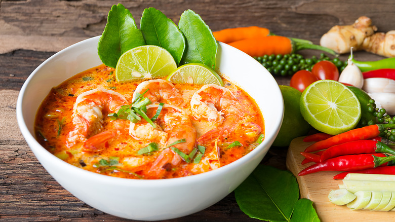 Hot and sour tom yum soup in a white bowl