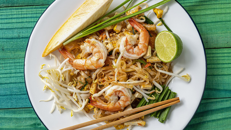 Prawn pad Thai noodles with chopsticks