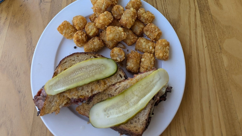 Reubenesque sandwich with tater tots