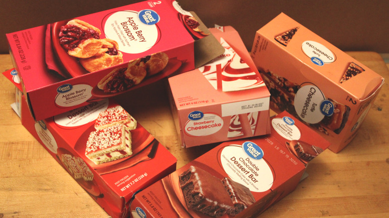 A scattered selection of boxes from Great Value brand desserts found in the freezer section