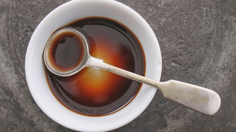 Worcestershire sauce in white dish with spoon
