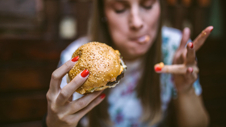 Girl enjoying a burger