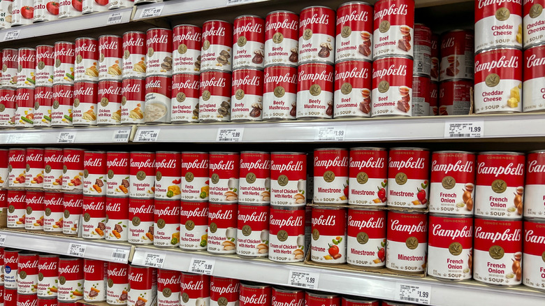 Varieties of Campbell's Soup Cans on the shelves in a supermarket. Utah, USA.