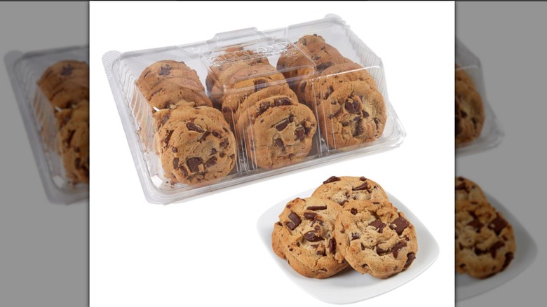 24-count plastic package of Costco gourmet chocolate chip cookie package with cookies in front on white plate