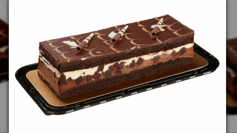 Costco tuxedo chocolate mousse cake on plastic base packaging on a white background.