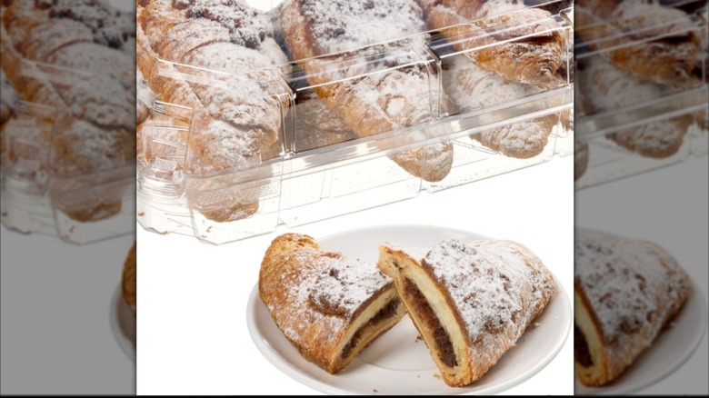 Costco twice baked chocolate croissant on white plate sliced in half with filling showing and a package of croissants is in the background.