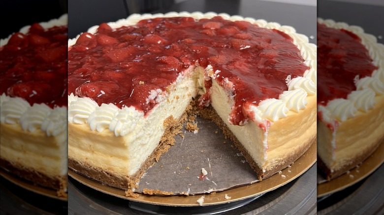 Strawberry Cheesecake with slice taken out of it