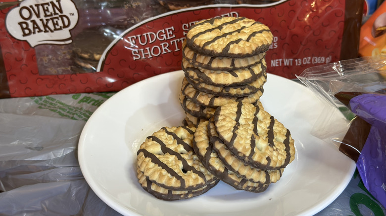 Stacked Oven Baked Fudge Striped Shortbread cookies from Dollar Tree on a white plate