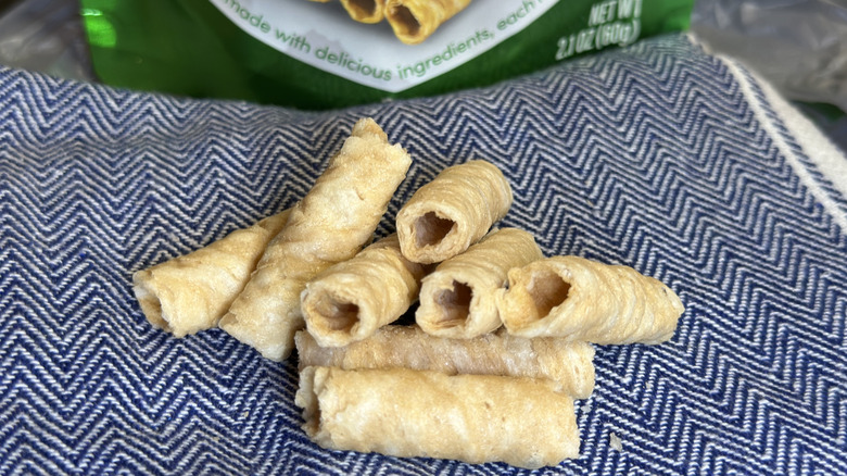 A stack of Tropical Fields Crispy Coconut Rolls from Dollar Tree on a blue towel