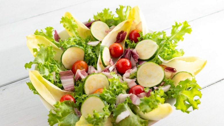 Bowl with fresh mixed vegetable salad