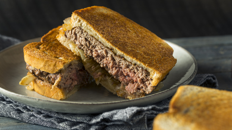 Cheesy Patty Melt Sandwich with Cheese and Onions on plate