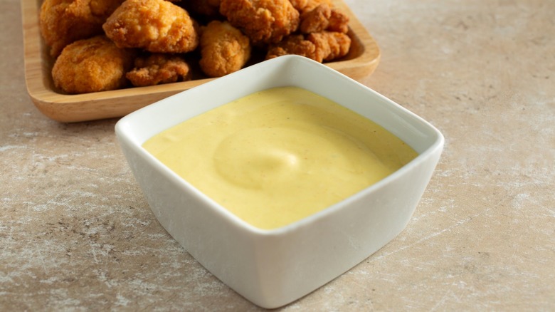 Honey mustard in rounded square bowl