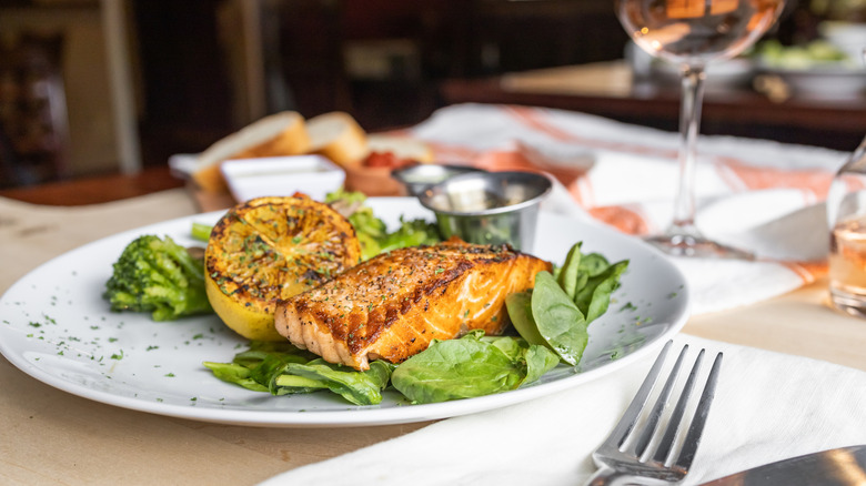 Grilled salmon on a white plate