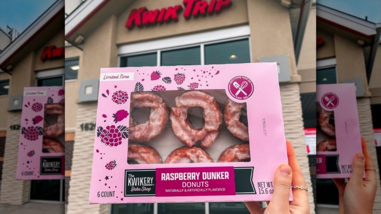 hand holding a box of raspberry dunkers in front of a Kwik Trip