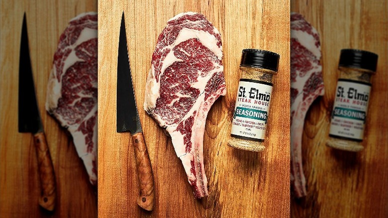 St. Elmo Steak House Seasoning with raw tomahawk steak and knife
