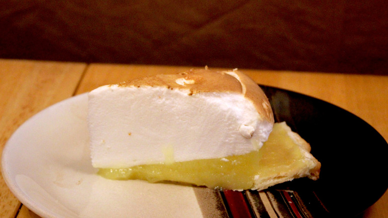 A slice of Cyrus O'Leary's Lemon Meringue Pie on plate