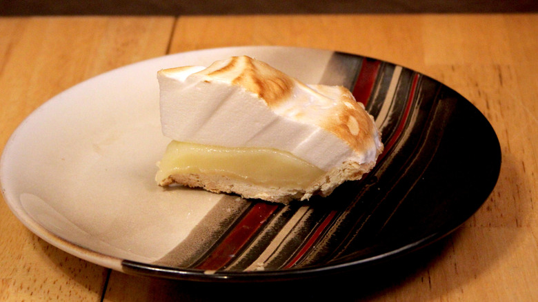 A slice of Freshness Guaranteed Lemon Meringue Pie on plate