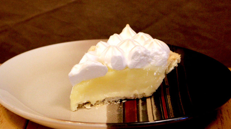 A slice of Marie Callender's Lemon Meringue Pie on plate