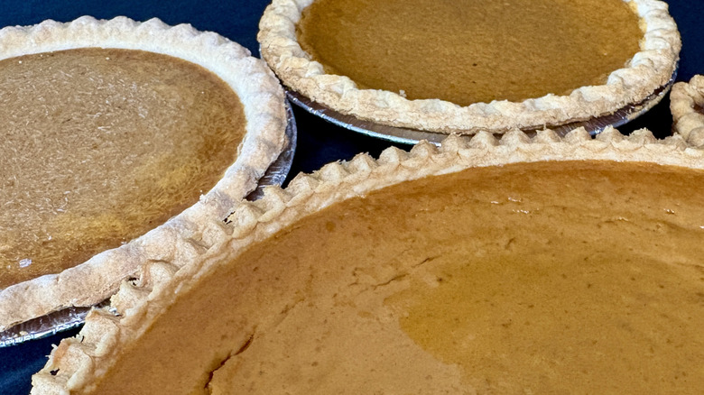 close-up of multiple full pumpkin pies