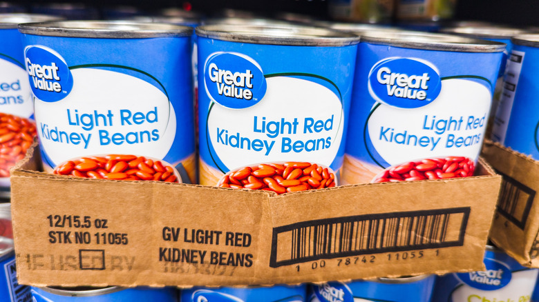 Rows of Great Value kidney beans in a blue and white can in a cardboard carton
