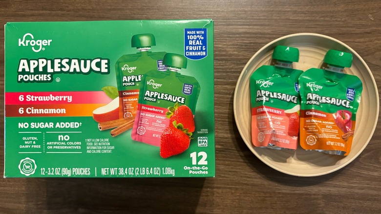 Kroger No-Sugar Added Assorted Strawberry and Cinnamon Applesauce Pouches box and seperate pouch on wooden table surface