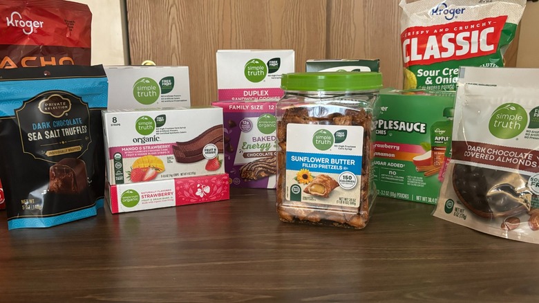 An array of Kroger snacks on wooden table