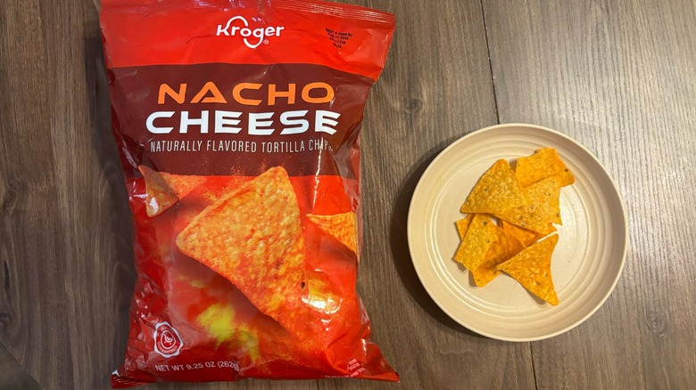 Kroger Nacho Cheese Tortilla Chips bag and nachos on plate