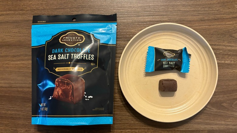 Private Selection Dark Chocolate Sea Salt Truffles Bag and truffle chocolate pieces on plate