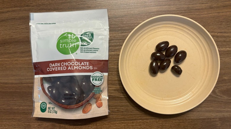 Kroger Simple Truth Dark Chocolate Covered Almonds bag and chocolate covered almonds on plate